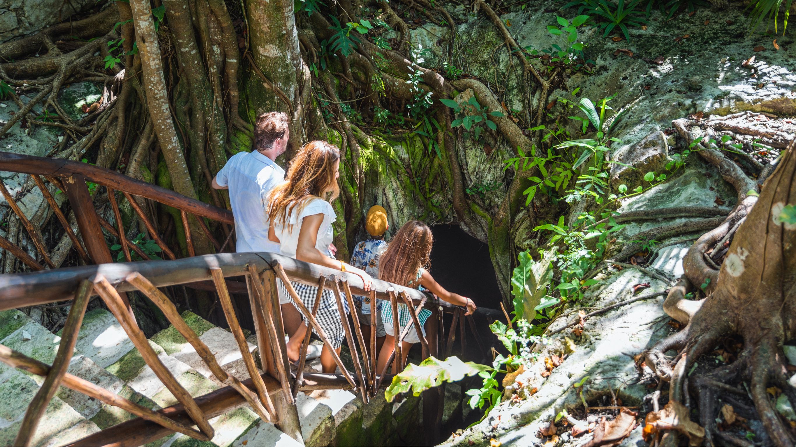 Family entering cenote at Mayakoba to explore